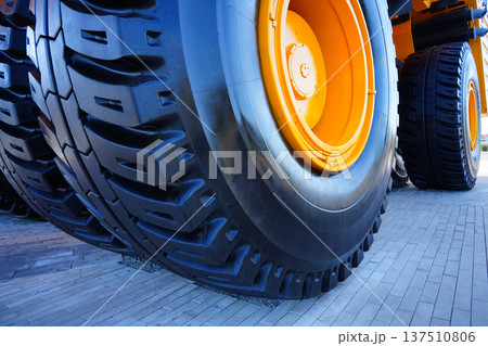 Tires of mining truck. Heavy Machinery Tire. Large tire for heavy machinery. Biggest tires, tyre 137510806