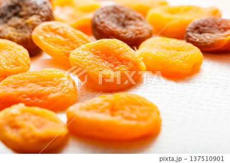 Detailed closeup of orange dried apricots 137510901