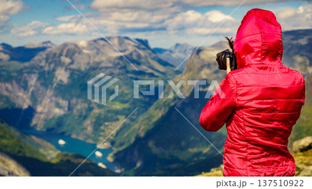 Tourist taking photo from Dalsnibba viewpoint Norway Tourist taking photo from Dalsnibba viewpoint Norway 137510922