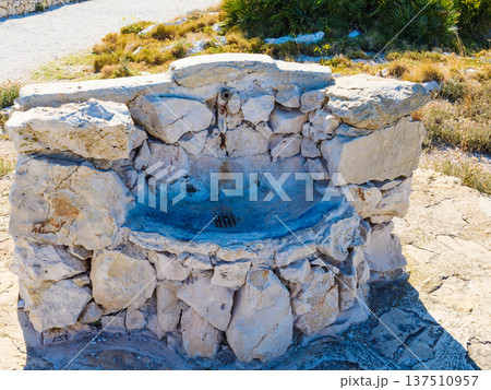 Stone water well in Mediterranean area 137510957