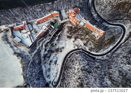 Beautiful old castle - top view from a drone. Winter landscape at sunset. Veveri Castle - City of Brno - Czech Republic - Europe. 137511027