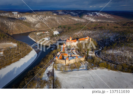 Beautiful old castle - top view from a drone. Winter landscape at sunset. Veveri Castle - City of Brno - Czech Republic - Europe. 137511030