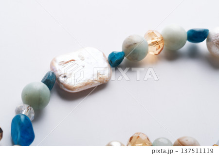 author trend necklace with different  beads  demonstrated  against white background. fashion and jewelry concept 137511119