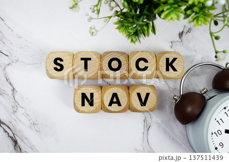 Stock NAV Stock portfolio tracker alphabet letters and alarm clock on marble background Stock NAV Stock portfolio tracker alphabet letters and alarm clock on marble background 137511439