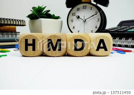 HMDA (Home Mortgage Disclosure Act) alphabet letters with alarm clock and calculator on white background HMDA (Home Mortgage Disclosure Act) alphabet letters with alarm clock and calculator on white background 137511450