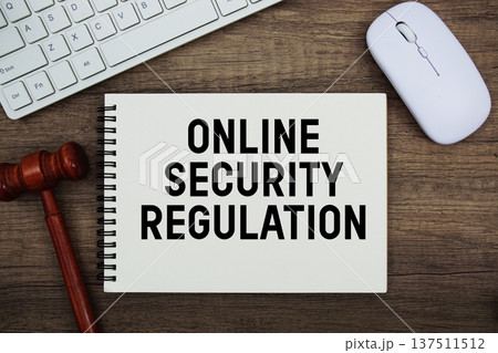 Online Security Regulation text written with gavel, keyboard and optical mouse on wooden background 137511512