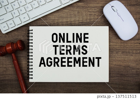Online Terms Agreement text written with gavel, keyboard and optical mouse on wooden background Online Terms Agreement text written with gavel, keyboard and optical mouse on wooden background 137511513