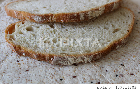 Closeup stock photo of homemade bread slices on the surface of yeast free lavash with grains Closeup stock photo of homemade bread slices on the surface of yeast free lavash with grains 137511583