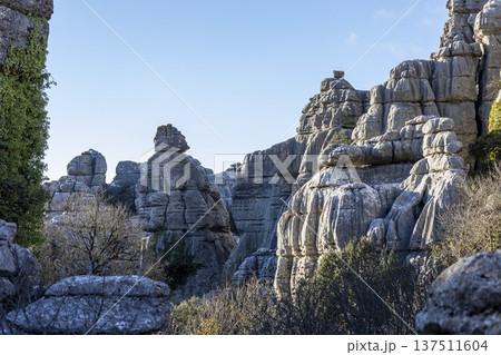 Exploring the unique rock formations at El Torcal in Spain during a sunny afternoon walk in nature Exploring the unique rock formations at El Torcal in Spain during a sunny afternoon walk in nature 137511604