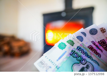 Heating payment. Save money wood stove. Russian ruble banknotes for payment of heating firewood.  137512098