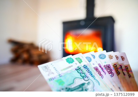Heating payment. Save money wood stove. Russian ruble banknotes for payment of heating firewood.  137512099