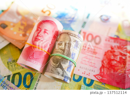 Chinese yuan, US dollars among various currencies background. Banknotes different countries  137512114