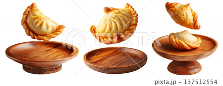 Set of Sambousek small crescent baked dumpling with twisted and pinched crust with cheese or meat, isolated on white background Set of Sambousek small crescent baked dumpling with twisted and pinched crust with cheese or meat, isolated on white background 137512554