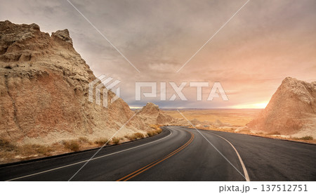 Picturesque road in Badlands National Park at sunset, USA. 137512751