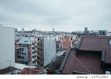 Dense residential architecture with apartment buildings and tiled rooftops in Belgrade city center. Urban landscape showing everyday housing and city development 137512963