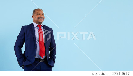 Mature african american businessman looking aside thoughtfully on studio background 137513617