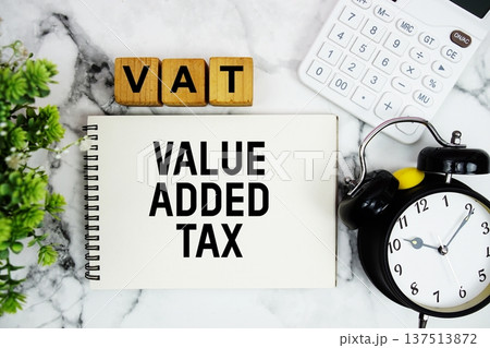 VAT Value Added Tax text with calculator and alarm clock on marble background VAT Value Added Tax text with calculator and alarm clock on marble background 137513872