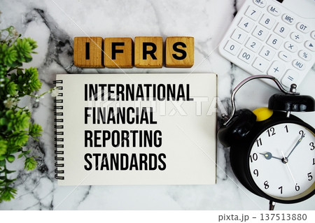 IFRS International Financial Reporting Standards text with calculator and alarm clock on marble background IFRS International Financial Reporting Standards text with calculator and alarm clock on marble background 137513880