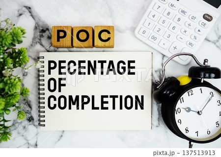 POC Percentage Of Completion text with calculator and alarm clock on marble background POC Percentage Of Completion text with calculator and alarm clock on marble background 137513913