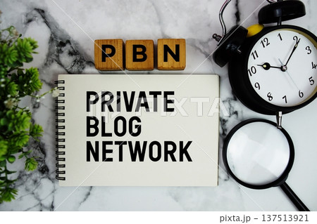 PBN Private Blog Network text with alarm clock and magnifying glass on marble background 137513921