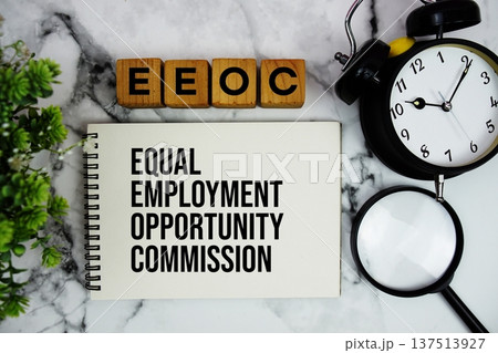 EEOC Equal Employment Opportunity Commission text with alarm clock and magnifying glass on marble background EEOC Equal Employment Opportunity Commission text with alarm clock and magnifying glass on marble background 137513927
