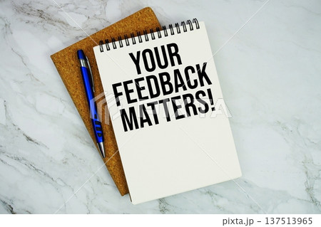 Your Feedback Matters! text written on notepad with pen on marble background Your Feedback Matters! text written on notepad with pen on marble background 137513965