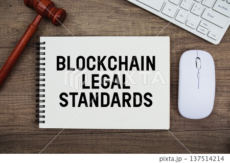 Blockchain Legal Standards text written with gavel, keyboard and optical mouse on wooden background Blockchain Legal Standards text written with gavel, keyboard and optical mouse on wooden background 137514214