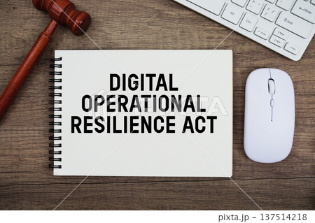 Digital Operational Resilience Act text written with gavel, keyboard and optical mouse on wooden background Digital Operational Resilience Act text written with gavel, keyboard and optical mouse on wooden background 137514218