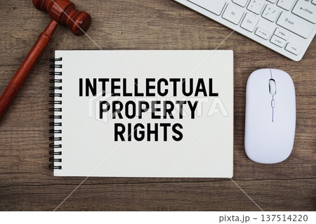 Intellectual Property Rights text written with gavel, keyboard and optical mouse on wooden background Intellectual Property Rights text written with gavel, keyboard and optical mouse on wooden background 137514220