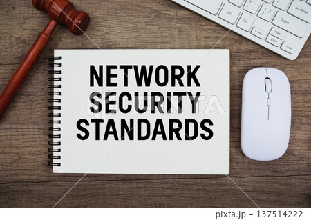 Network Security Standards text written with gavel, keyboard and optical mouse on wooden background 137514222