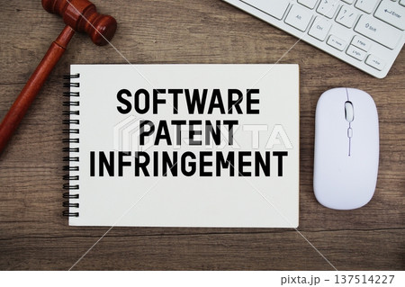 Software Patent Infringement text written with gavel, keyboard and optical mouse on wooden background Software Patent Infringement text written with gavel, keyboard and optical mouse on wooden background 137514227