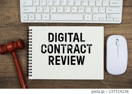 Digital Contract Review text written with gavel, keyboard and optical mouse on wooden background Digital Contract Review text written with gavel, keyboard and optical mouse on wooden background 137514236