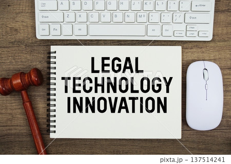 Legal Technology Innovation text written with gavel, keyboard and optical mouse on wooden background 137514241