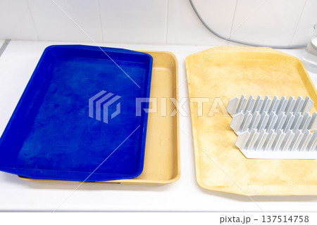 laboratory equipment. plastic tube racks on a yellow plastic tray. laboratory equipment. plastic tube racks on a yellow plastic tray. 137514758
