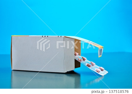 Open Medication Triangle Pink Pills in Aluminum Foil Packaging Strip Blue Background Copy Space Top Open Medication Triangle Pink Pills in Aluminum Foil Packaging Strip Blue Background Copy Space Top 137518576