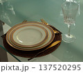 table set on white plates in restaurant 137520295