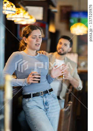Man tries unsuccessfully to flirt with woman Man tries unsuccessfully to flirt with woman 137520976