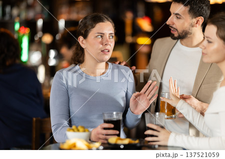 Young man flirting with two women getting rejected Young man flirting with two women getting rejected 137521059