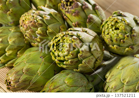 Artichokes on wooden table Artichokes on wooden table 137521211
