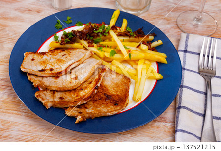Appetizing fried pork with potatoes and herbs 137521215