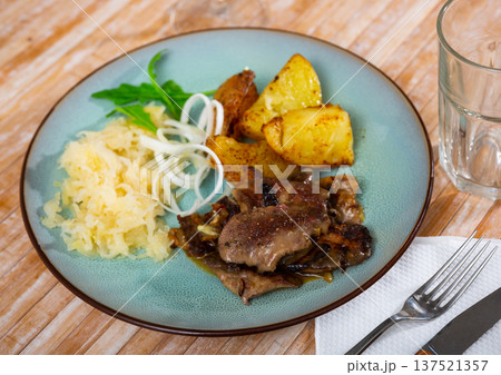 Rabbit liver with boiled potatoes and sauerkraut Rabbit liver with boiled potatoes and sauerkraut 137521357