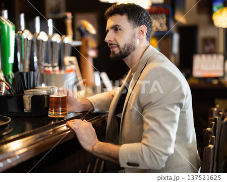 Young man spending time alone at bar Young man spending time alone at bar 137521625