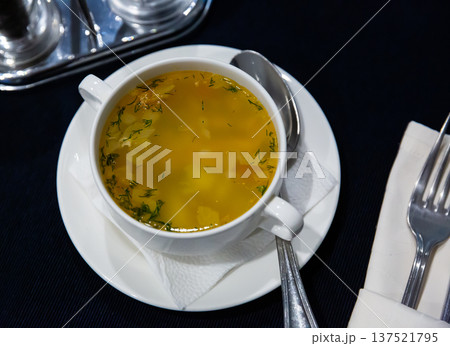 Hearty vegetable soup with fresh chopped dill 137521795