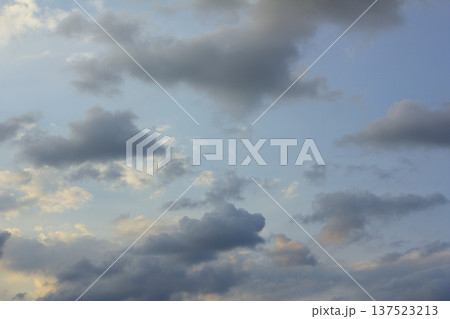 It's a blue sky with atmospheric puffy clouds. It's a blue sky with atmospheric puffy clouds. 137523213