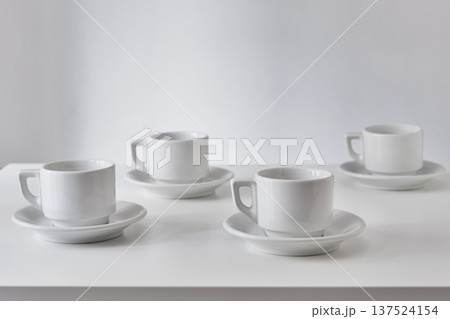 White cups on table White cups on table 137524154
