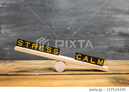 Wooden Seesaw Showing STRESS And CALM Balance Concept Wooden Seesaw Showing STRESS And CALM Balance Concept 137524195