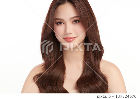 A beautiful young Asian woman with clean, fresh skin against a white background. Skincare, facial treatment, cosmetology, beauty, and spa. An elegant portrait of an Asian woman. 137524670