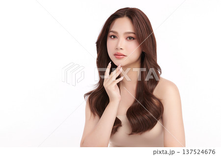 A beautiful young Asian woman with clean, fresh skin against a white background. Skincare, facial treatment, cosmetology, beauty, and spa. An elegant portrait of an Asian woman. A beautiful young Asian woman with clean, fresh skin against a white background. Skincare, facial treatment, cosmetology, beauty, and spa. An elegant portrait of an Asian woman. 137524676