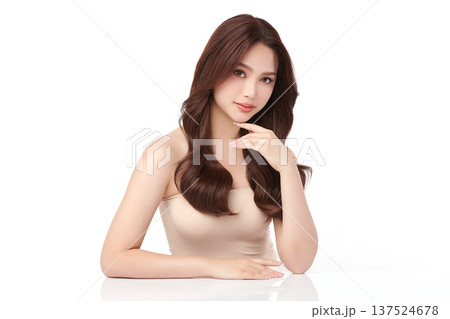A beautiful young Asian woman with clean, fresh skin against a white background. Skincare, facial treatment, cosmetology, beauty, and spa. An elegant portrait of an Asian woman. A beautiful young Asian woman with clean, fresh skin against a white background. Skincare, facial treatment, cosmetology, beauty, and spa. An elegant portrait of an Asian woman. 137524678