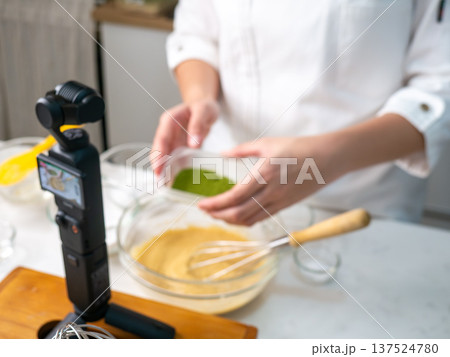 Food Content Creator Recording Cooking Video with Action Camera and Studio Lighting Setup Food Content Creator Recording Cooking Video with Action Camera and Studio Lighting Setup 137524780